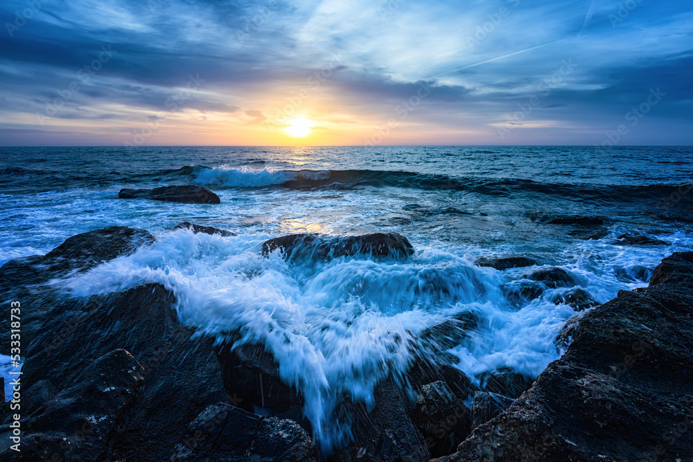 Blue hour in the sunrise at the sea shore. Horizontal view