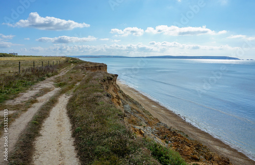 view of coastal landscape from top of cliff. Coastline trail with sea view in south of England.
