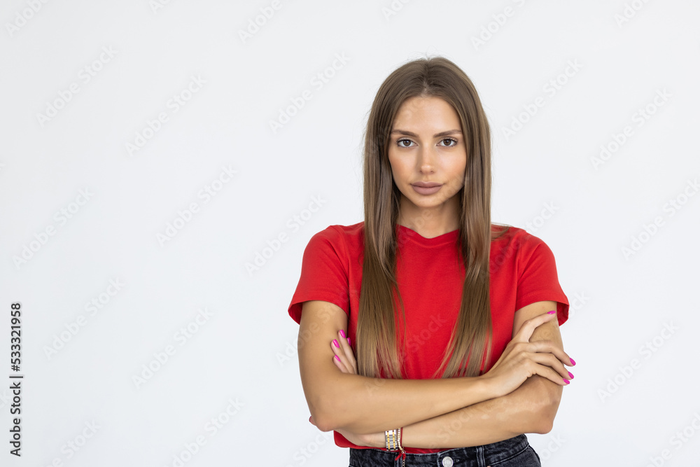 Obraz premium Portrait of young caucasian woman cross arms on chest, smile from joy, laughing and looking at right side copy space or logo, standing against white background