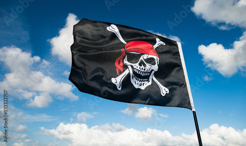 Pirate flag waving on sky