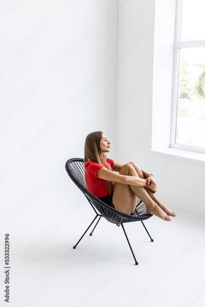 Young beautiful woman enjoys her morning tea looking at the mountains. Freedom concept. Calmness and relax, woman happiness. Selective focus Young beautiful woman enjoys her morning tea looking at the mountains. Freedom concept. Calmness and relax, woman happiness. Selective focus
