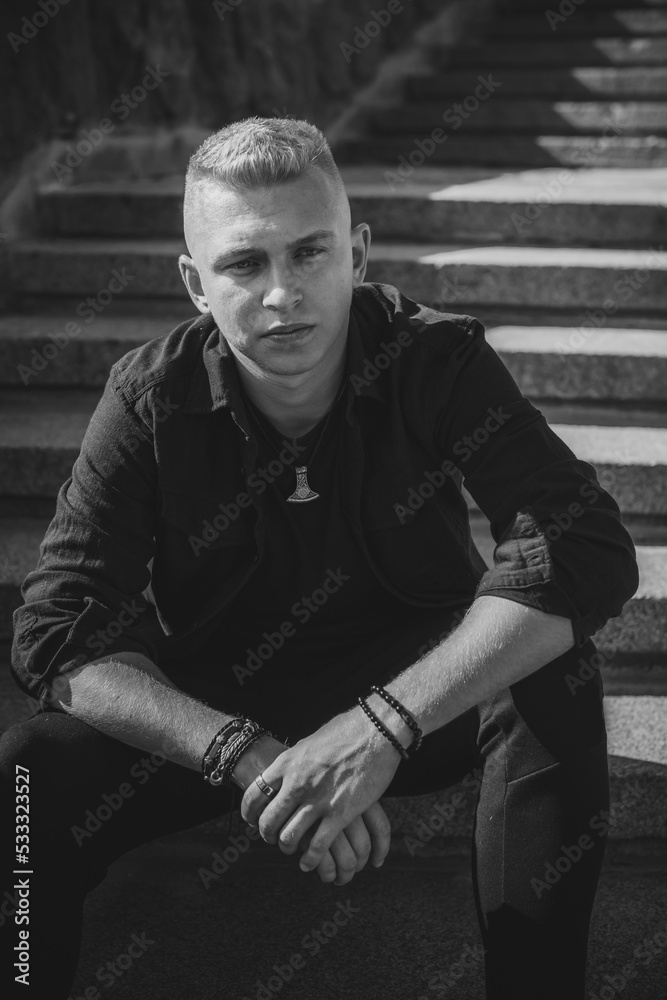 Young European student guy with a sad philosophical mood. The concept of life youth years, problems and depression. Crisis of life Young European student guy with a sad philosophical mood. The concept of life youth years, problems and depression. Crisis of life