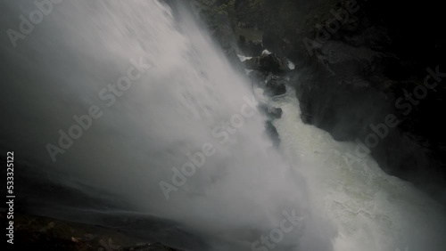 Stream Strongly Flows From Steep Mountains At Devil's Cauldron Waterfall In Rio Verde, Banos, Ecuador. High Angle