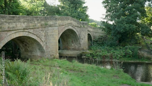 Rievaulx Bridge, an 18th Century stone bridge  of three arches.
A concrete ramp can still be seen - this is the remains of a ford crossing used by tanks from a training camp at Duncombe Park in WW2 photo