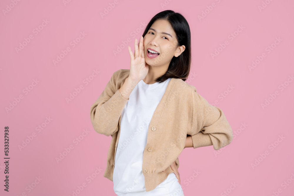 Surprised happy beauty asian woman look at camera in excitement. She act like a telling something Isolated on pink background. Surprised happy beauty asian woman look at camera in excitement. She act like a telling something Isolated on pink background.