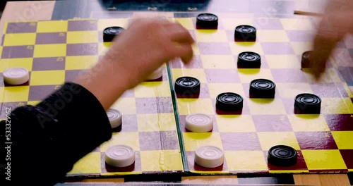 coach arranges on the draughts board, a game of combinations in draughts photo