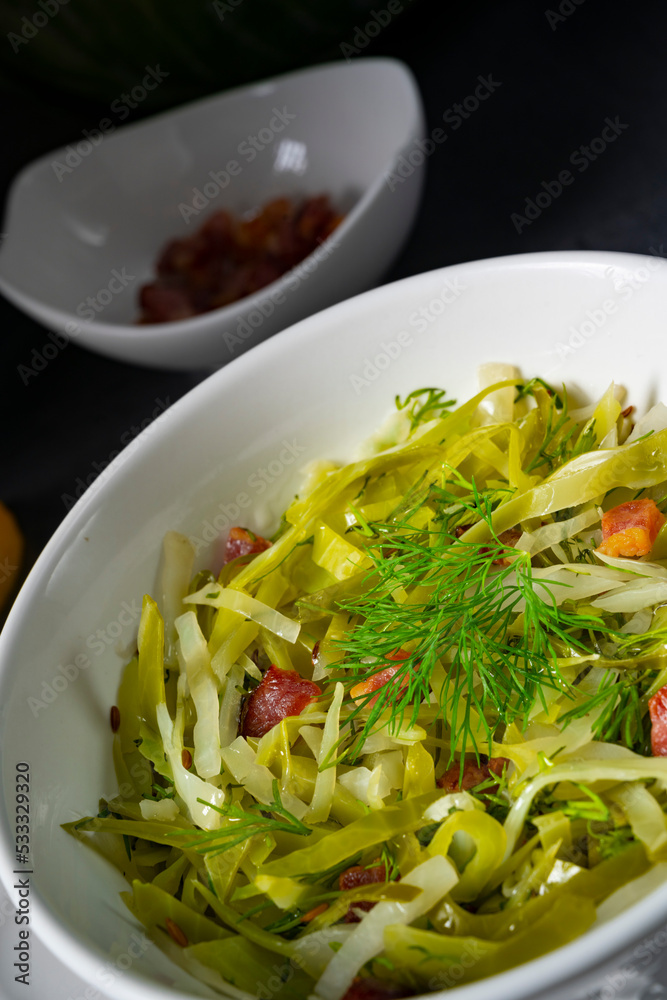 White cabbage with dill and diced bacon