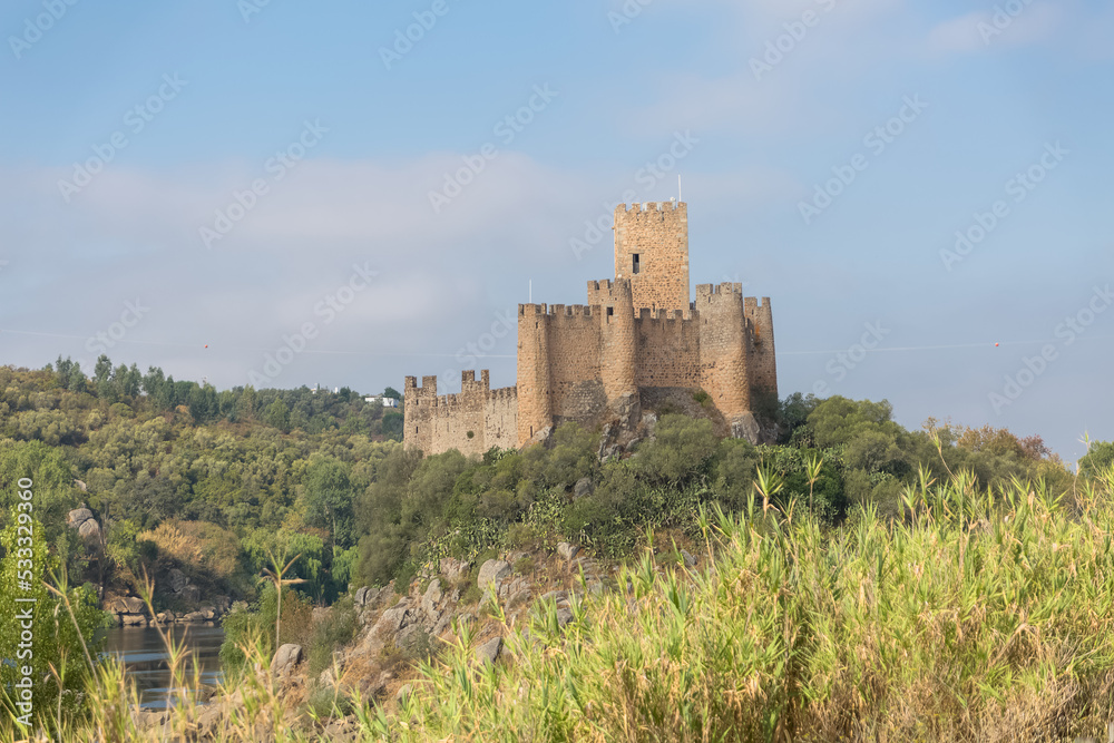 View at the Castle of Almourol is a medieval castle atop the islet of Almourol in the middle of the Tagus River