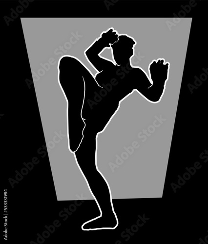 Kickboxing or muaythai fighter prepares to deliver a high kick