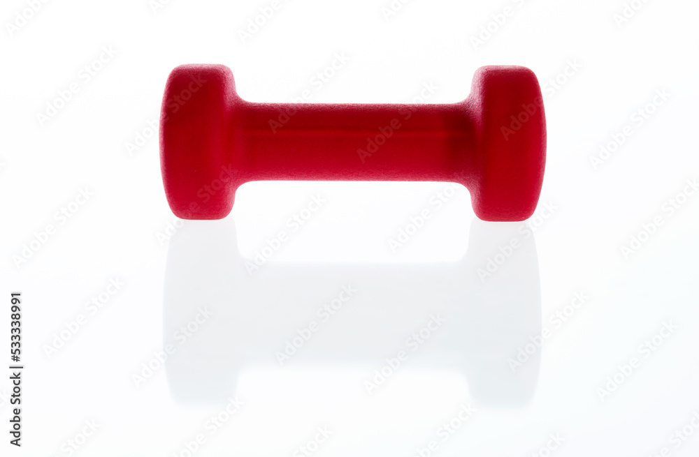 Single red dumbbell isolated on white background Single red dumbbell isolated on white background