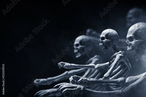 Group of skeleton on dark background