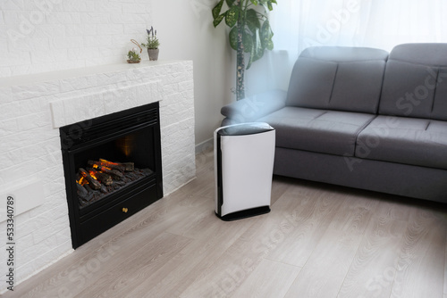 White air ionizer. Concept of caring for fresh air in the apartment. Caring for well-being and health. Air filter. photo