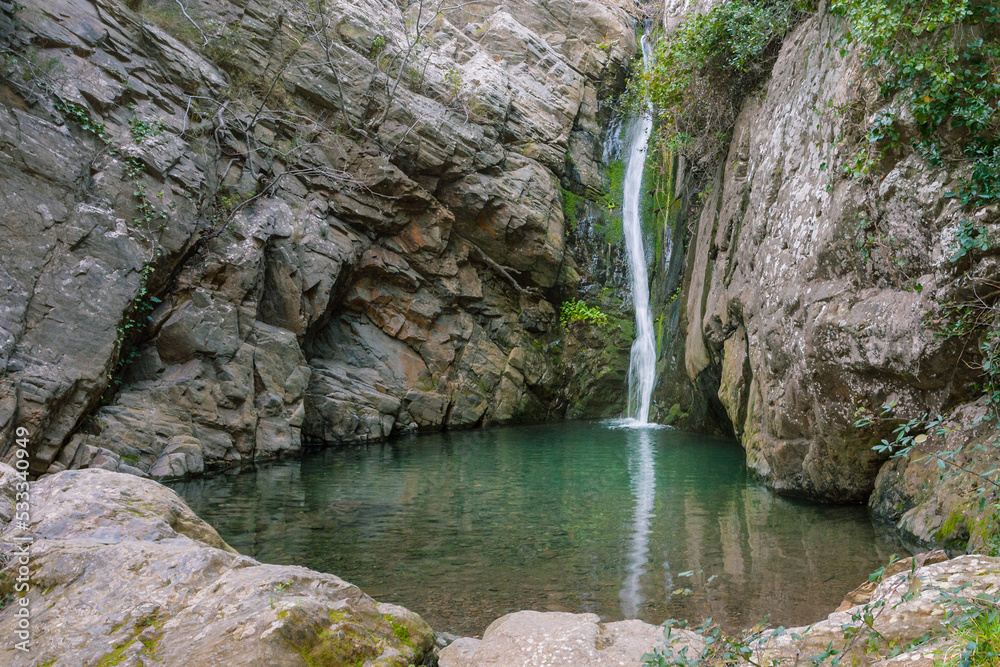 Small pool between rocks caused by a unique waterfall. Small pool between rocks caused by a unique waterfall.