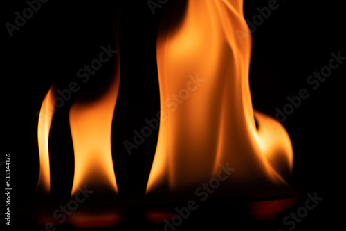 burning power of the flame, Flames, and burning sparks close-up, fire patterns, the glow of fire in the dark