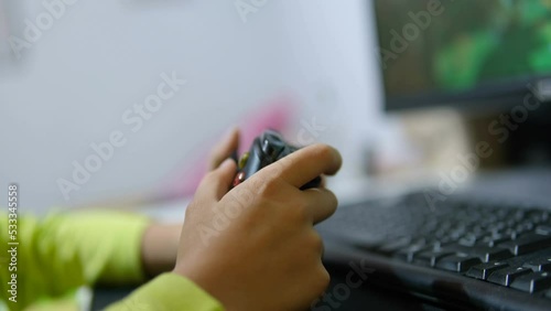 Child boy playing console game on at home,kids computer videogames addiction