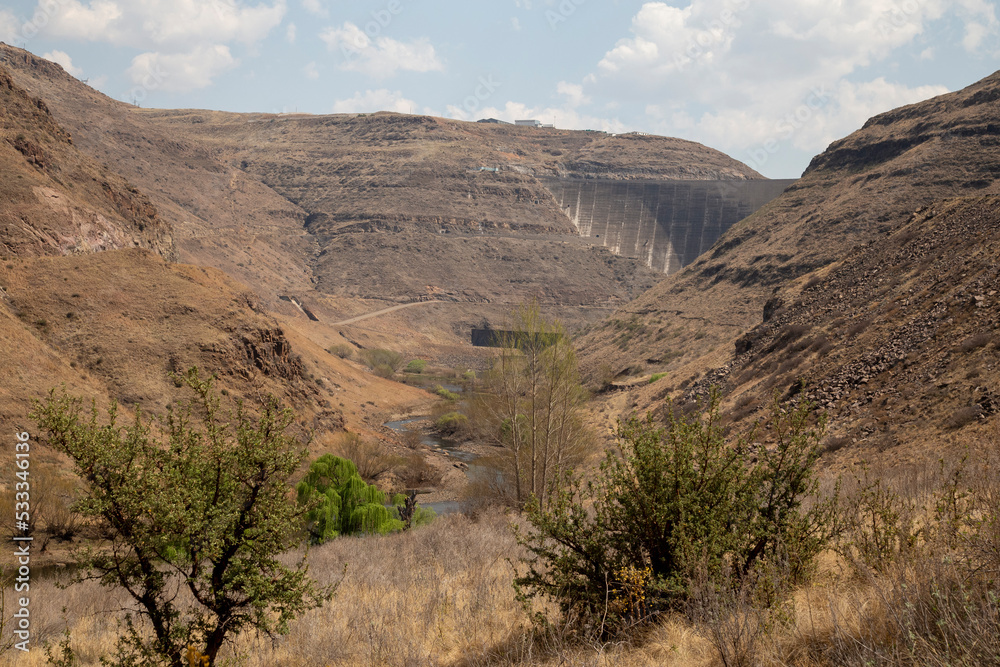 Katse Lesotho dam with dam wall and mountains clouds and blue skies