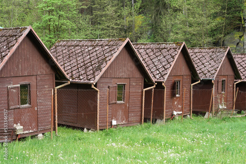 Old wooden huts in forest camp, camping in the wild concept