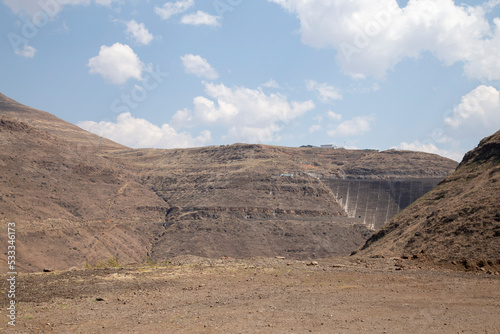 Katse Lesotho dam with dam wall and mountains clouds and blue skies