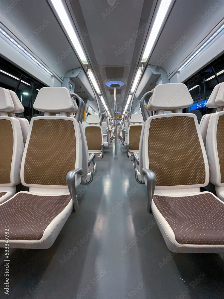 Fototapeta premium empty train car seats, train mode of transportation