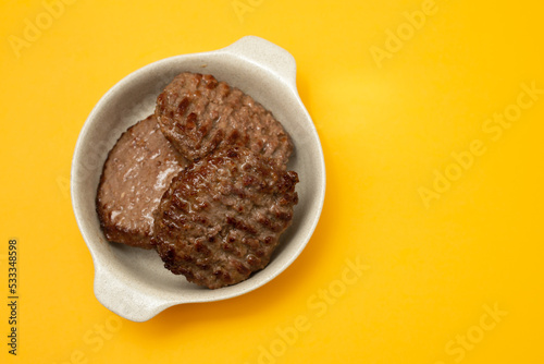 three fried ground meat in light brown bowl