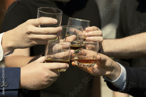 man holding a glass of whisky