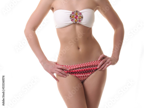young woman in bikini on white
