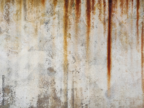 The surface of the cement wall with paint stains from prolonged washing by water