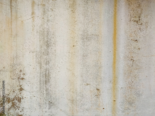 The surface of the cement wall with paint stains from prolonged washing by water