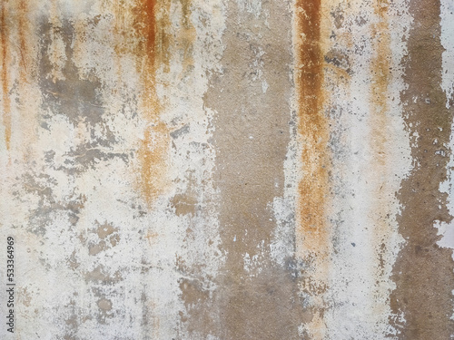The surface of the cement wall with paint stains from prolonged washing by water