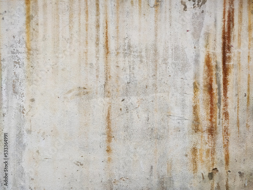 The surface of the cement wall with paint stains from prolonged washing by water