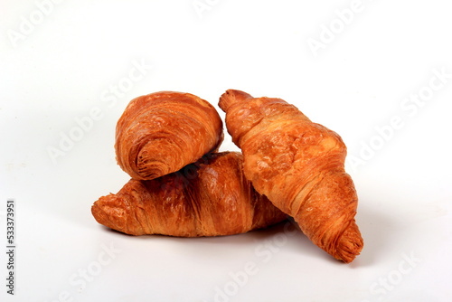 Fresh french croissant on a white background