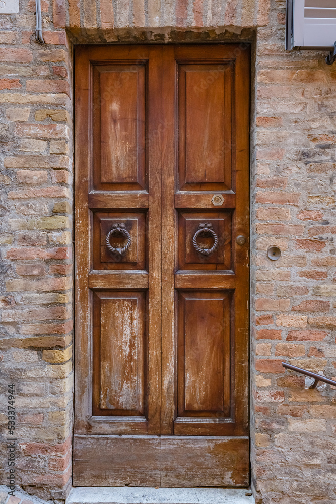 Walking Urbino city streets. Close up view of beautiful ancient wooden door