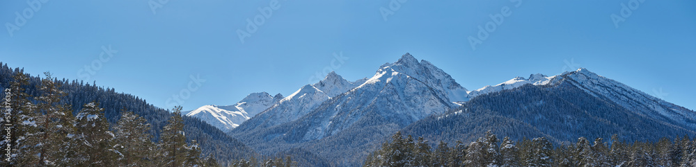 Panorame of winter landscape in mountains at sunny day