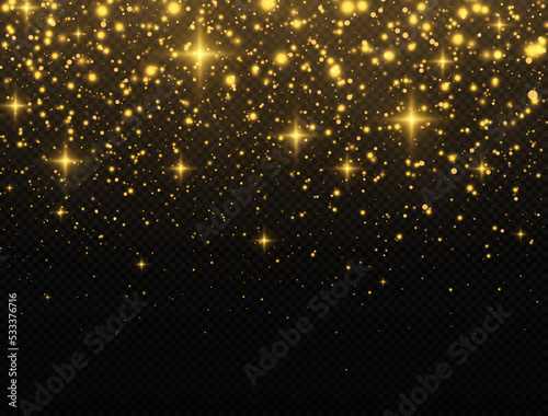 Golden confetti and glitter texture on black background. Sparkling space magical dust particles. Christmas concept. © FlammaChe