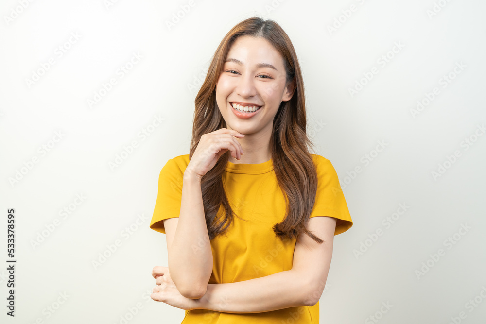 happy young asian woman smiling isolated on background. happy young asian woman smiling isolated on background.