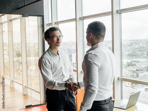 Businessmen are talking at a business meeting © Саша Руденко