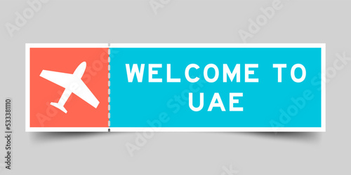 Orange and blue color ticket with plane icon and word welcome to UAE (united arab emirates) on gray background