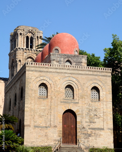 The red domes of the church of San Cataldo in Byzantine and Arab-Norman architecture near the Martorana in Piazza Bellini and Palermo skyline.