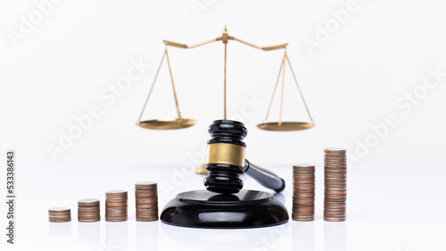 Investment Financial growth of legal and justice education is represented by a gavel-balanced stack of coins graph. Judge Power halt money Corruption in tax payments and laundry concept, copy space