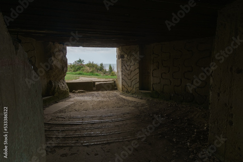 Inside an empty german bunker of the Second World War, remains of the Atlantic Wall at Omaha Beach, Normandy, France photo