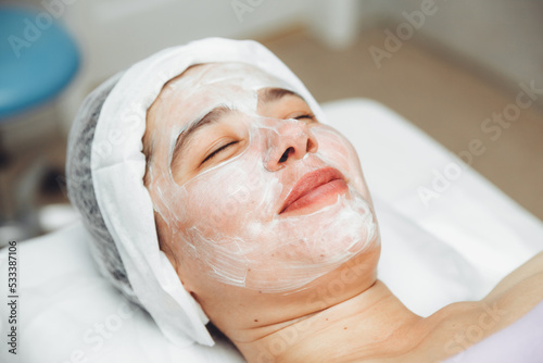 A cosmetologist does facial care and apply a face mask. cleansing a heavily soiled face. acne on the skin. skin rashes. mechanical face painting.