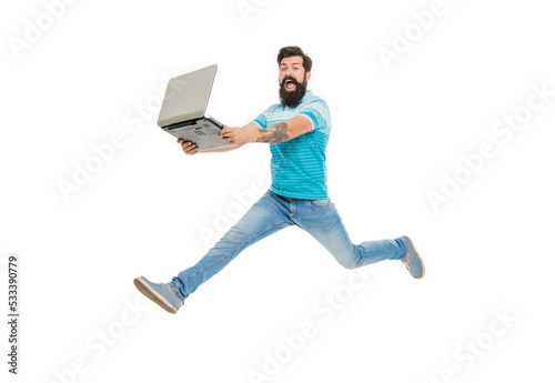 Energetic guy computer user. Bearded guy jumping with laptop. Excited guy midair isolated on white © be free