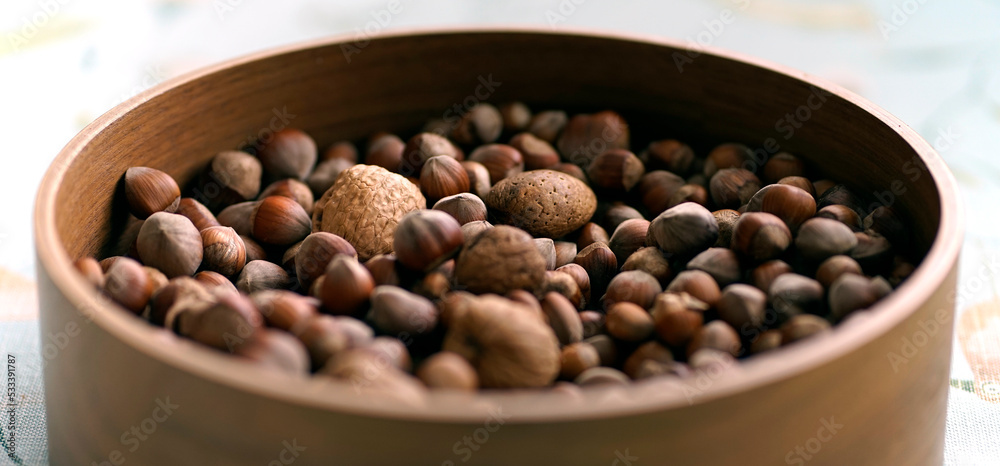 Bowl with nuts: almonds, walnuts and hazelnuts Bowl with nuts: almonds, walnuts and hazelnuts