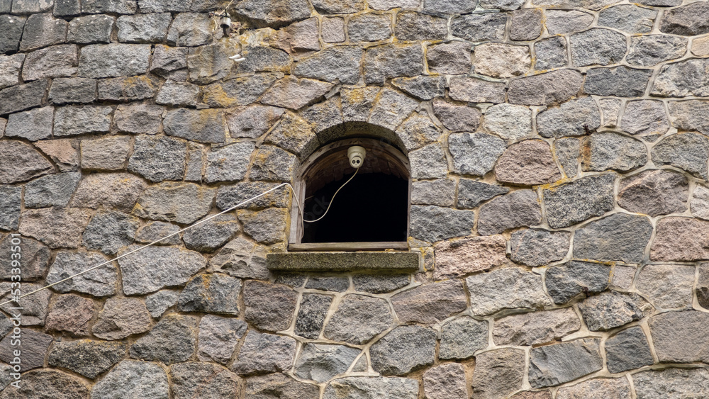 Security camera in the window of an abandoned castle in Latvia Security camera in the window of an abandoned castle in Latvia