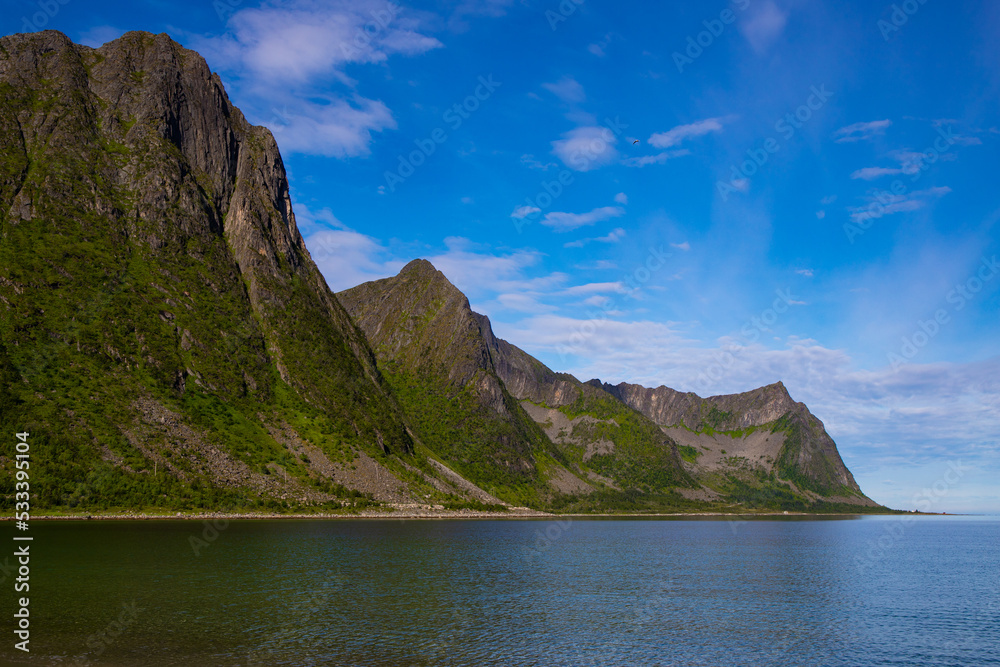 Mighty mountains rising from the sea. The landscape of the stunning Norwegian island of Senja