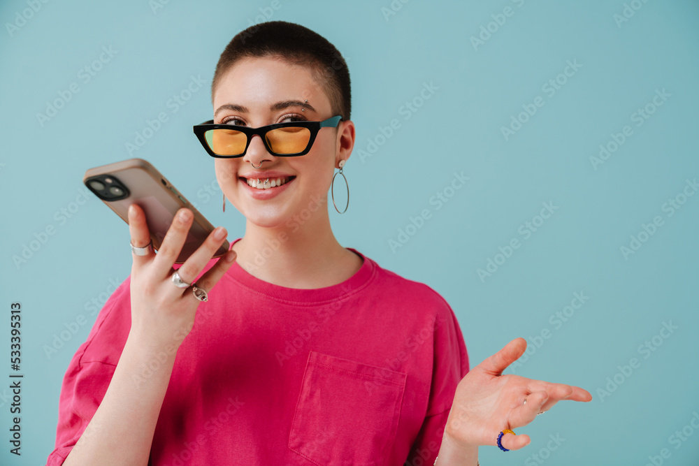 Young woman wearing sunglasses talking on cellphone Young woman wearing sunglasses talking on cellphone