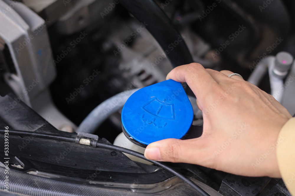 Hand of car auto mechanic engine, technician service check coolant