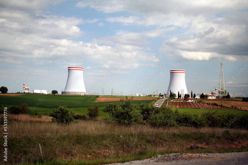 Two massive big chimneys of coolers of an old inverter converter energy station, power plant in Turkey. Coal plant, natural gas converter, electric energy production. Two massive big chimneys of coolers of an old inverter converter energy station, power plant in Turkey. Coal plant, natural gas converter, electric energy production.