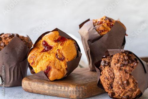 Muffins cake. Bakery products. Chocolate and fruit cake on gray background. close up