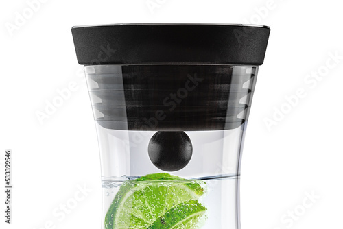 closeup of a carafe with water and lime